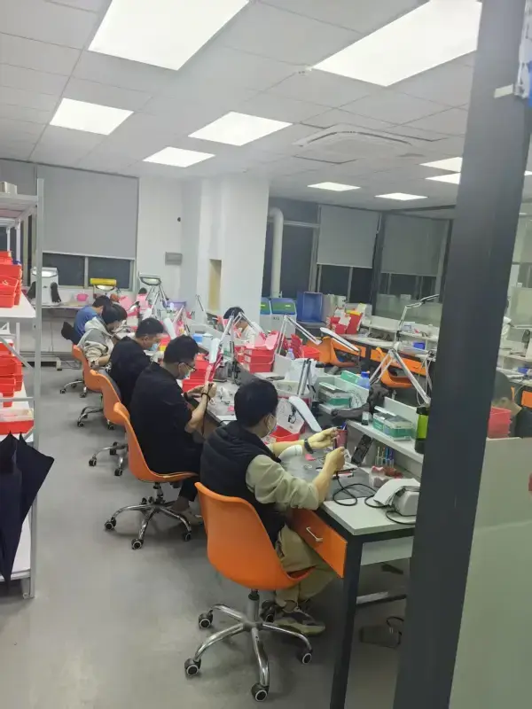 Dental lab team working at computers in the CAD design area