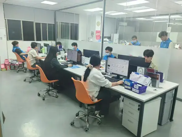 Open dental design office with technicians working on digital cases