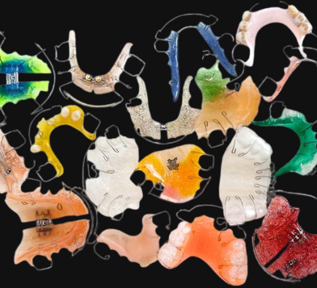 assorted custom orthodontic appliances with acrylic and wire designs