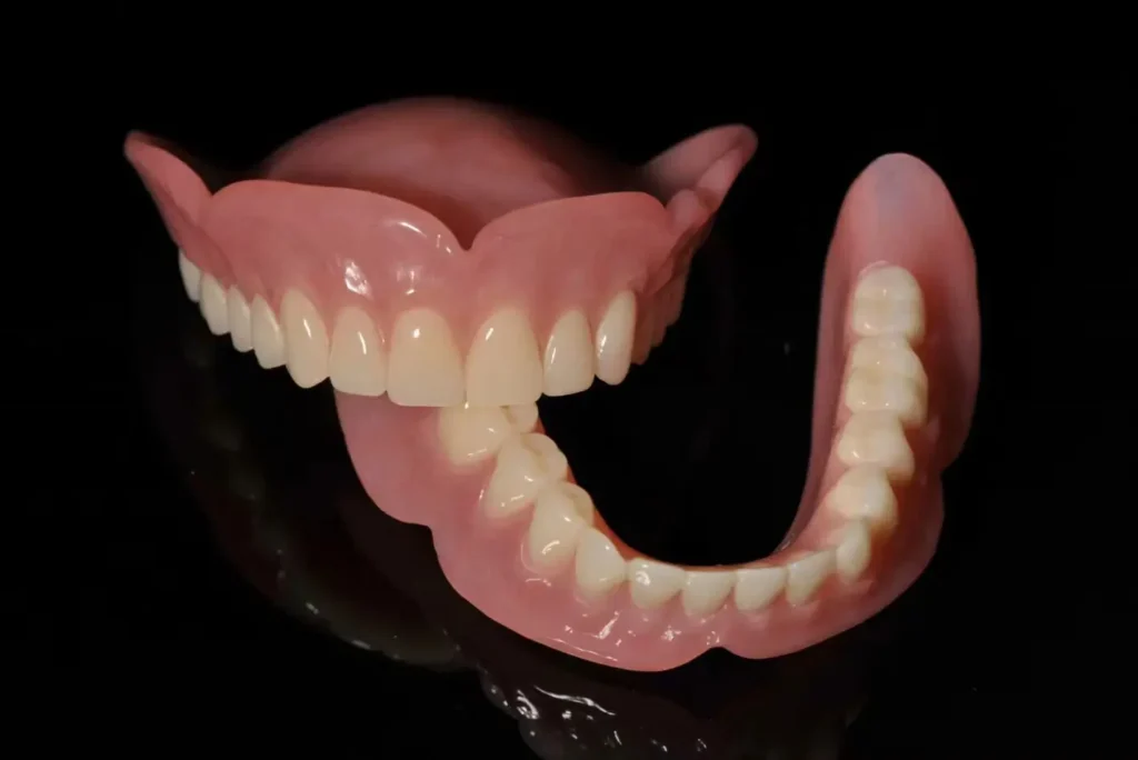 Removable dentures including complete dentures and flexible partial dentures